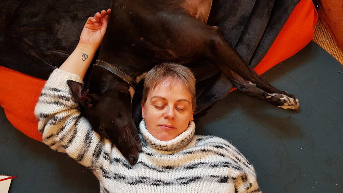 Yoga Reading - Yoga Nidra 16 hour Teacher Training - Theo Wildcroft resting with her dog